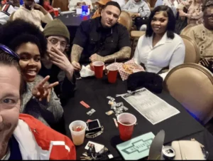 Fans at a table taking a photo op